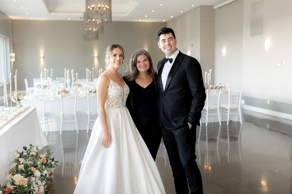 Bride and groom with Ottawa Wedding Planner in reception room of Le Belvedere photo by Agatha Rowland