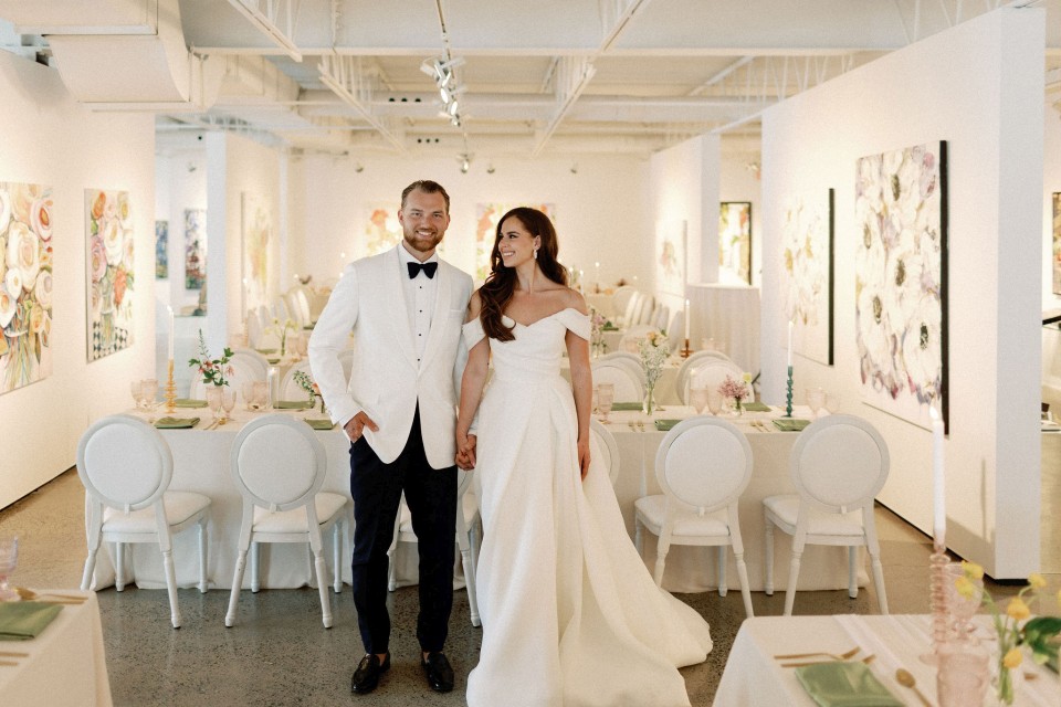 Bride and groom in colourful Art Gallery photo by Scott Wilson | Erica Irwin Weddings and Events