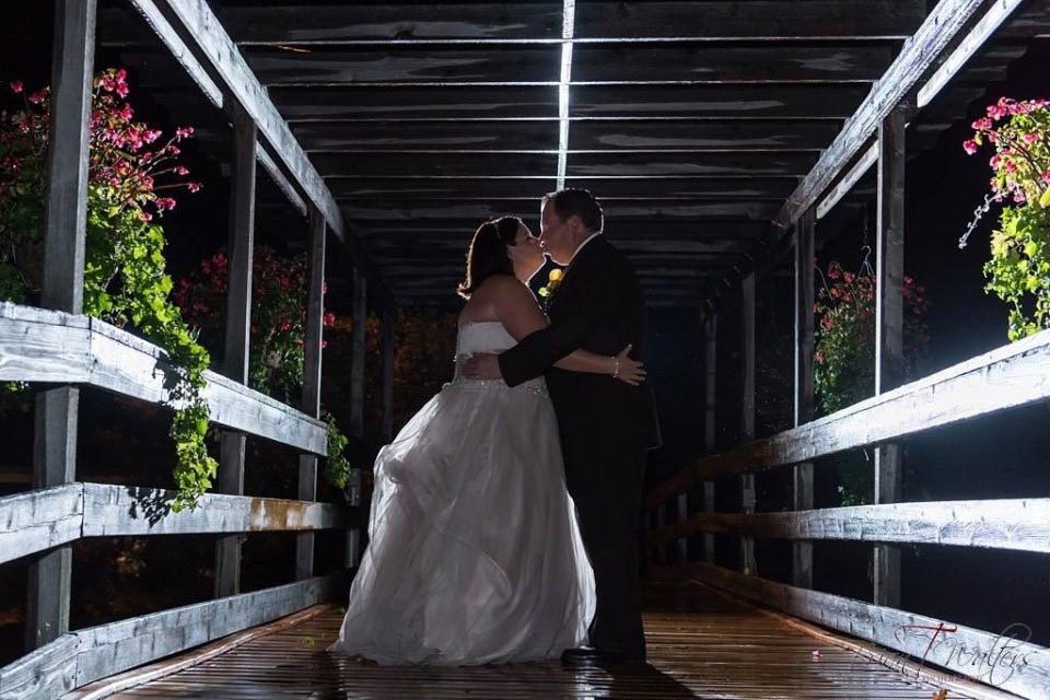 Couple kissing on bridge | Orchard View Wedding and Event Centre | Brian T Walters Photography