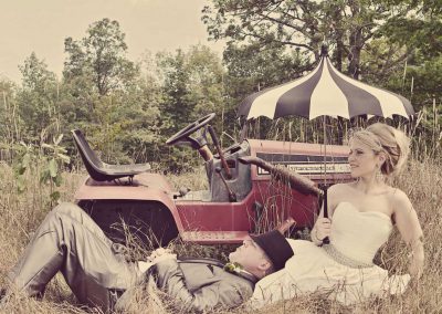 Bride and groom red antique tractor | Sala San Marco | Renaissance Studios