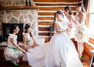 Bridesmaids ivory dresses green belts | Stonefields Heritage Farm | Themotions Photography