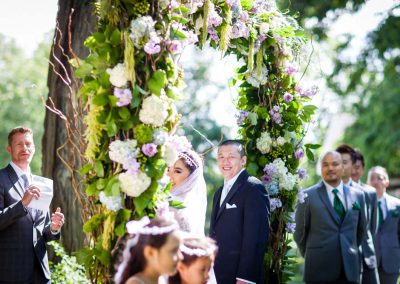 Floral archway wedding ceremony | Stonefields Heritage Farm | Themotions Photography