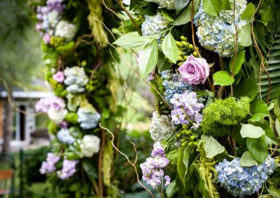 White green purple floral wood archway | Stonefields Heritage Farm | Themotions Photography