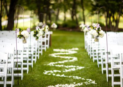 Outdoor ceremony white chairs white aisle petal design | Stonefields Heritage Farm | Themotions Photography