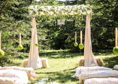 Floral arbor burlap green and white florals chandelier | Private Residence Wedding | Union Eleven Photographers