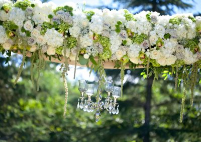 White Green with chandelier floral arbor ceremony | Private Residence Wedding | Union Eleven Photographers