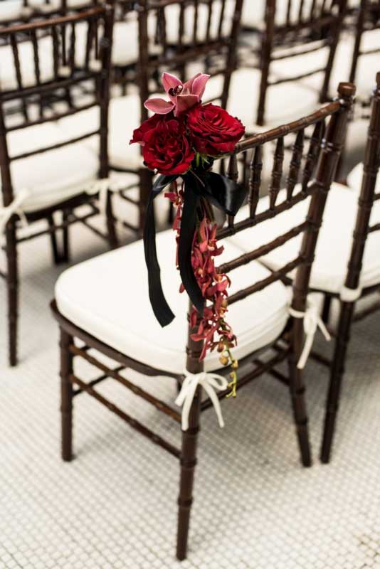 Red roses and orchid mahogany chiavari ceremony | Canadian Museum of Nature | Union Eleven Photographers Red roses and orchid mahogany chiavari ceremony | Canadian Museum of Nature | Union Eleven Photographers
