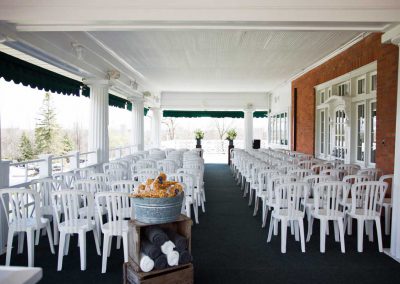 Wedding Ceremony on wraparound porch white pillars and chairs | Rivermead Golf Ottawa | AMBphoto